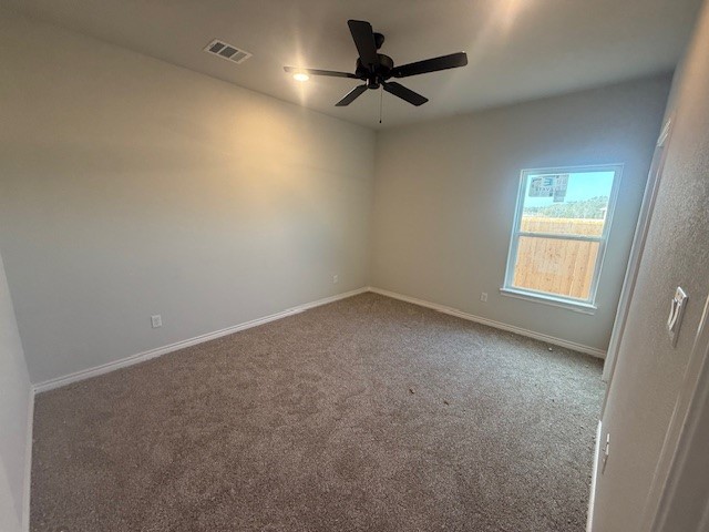 6422 Raleigh Loop College Station, TX 77845 - Photo 6 of 21 an empty room with a ceiling fan and a window