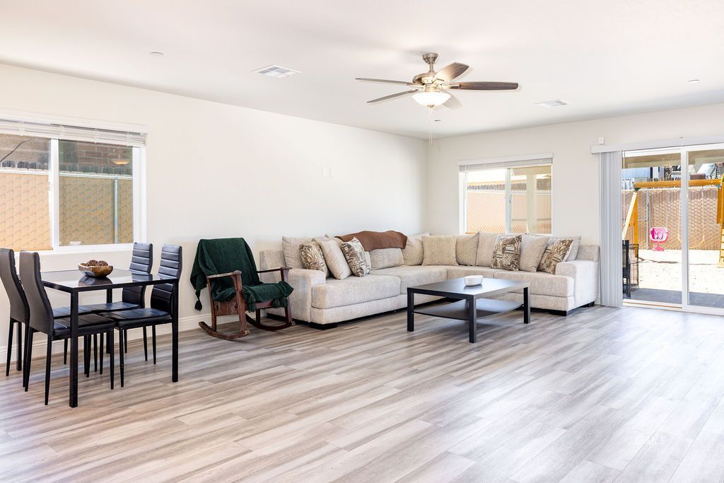 1229 South Ranger Street Ridgecrest, CA 93555 - Photo 9 of 36 a living room with furniture and a wooden floor