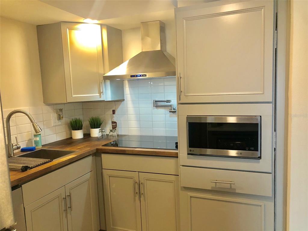 954 Lake Destiny Road, Unit E Altamonte Springs, FL 32714 - Photo 9 of 11 a kitchen with a sink and cabinets