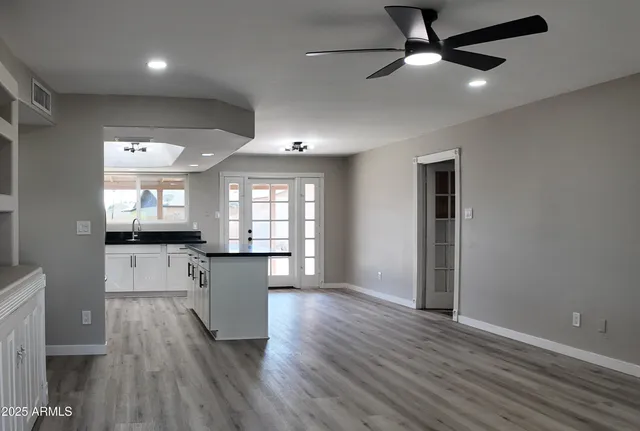 a kitchen with a refrigerator and a sink