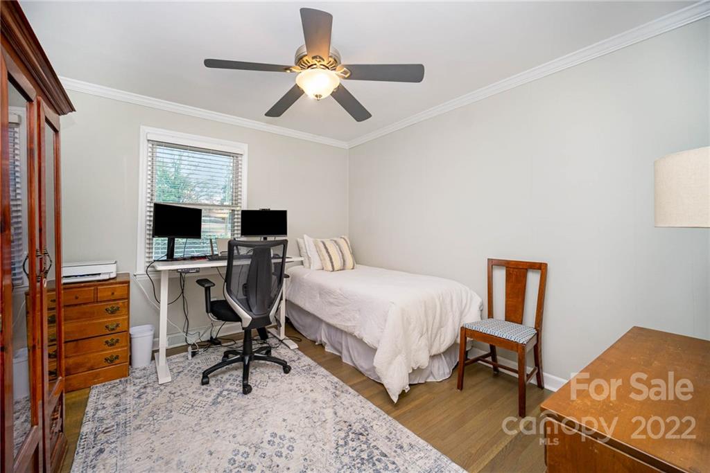 5200 Londonderry Road Charlotte, NC 28210 - Photo 12 of 28 a bedroom with a bed and a desk