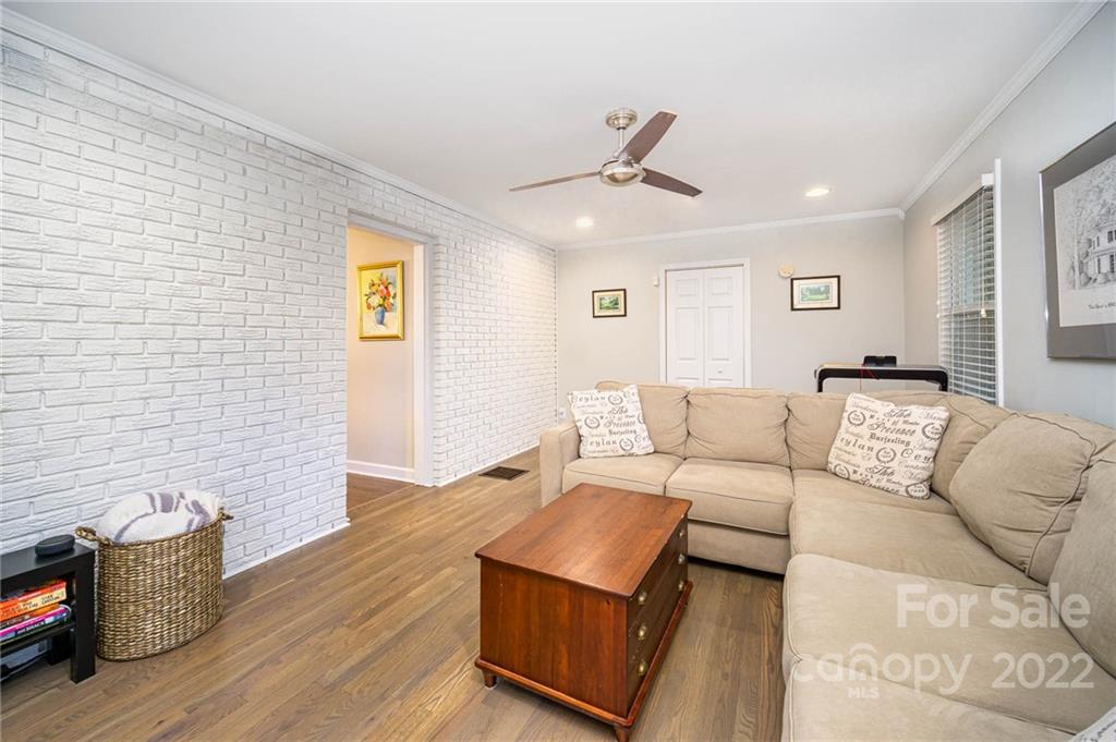 5200 Londonderry Road Charlotte, NC 28210 - Photo 17 of 28 a living room with furniture and a wooden floor