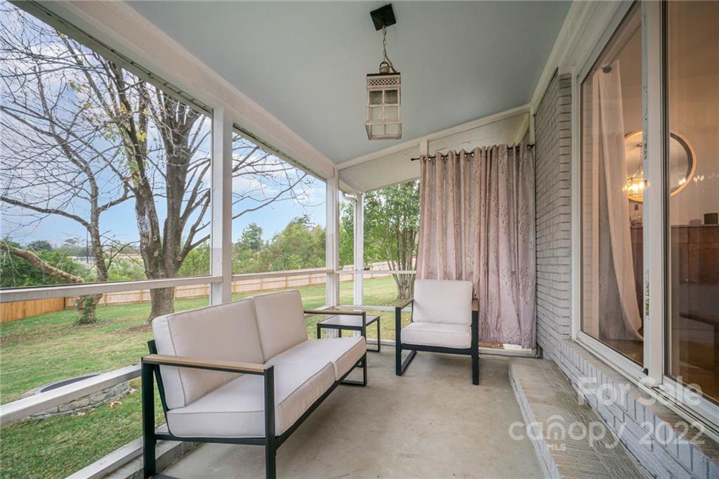 5200 Londonderry Road Charlotte, NC 28210 - Photo 20 of 28 a balcony with couple of chairs and a swing