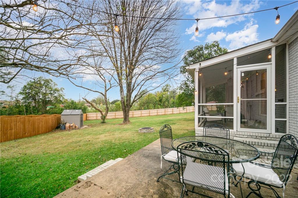5200 Londonderry Road Charlotte, NC 28210 - Photo 21 of 28 a view of a backyard with couches plants and large trees