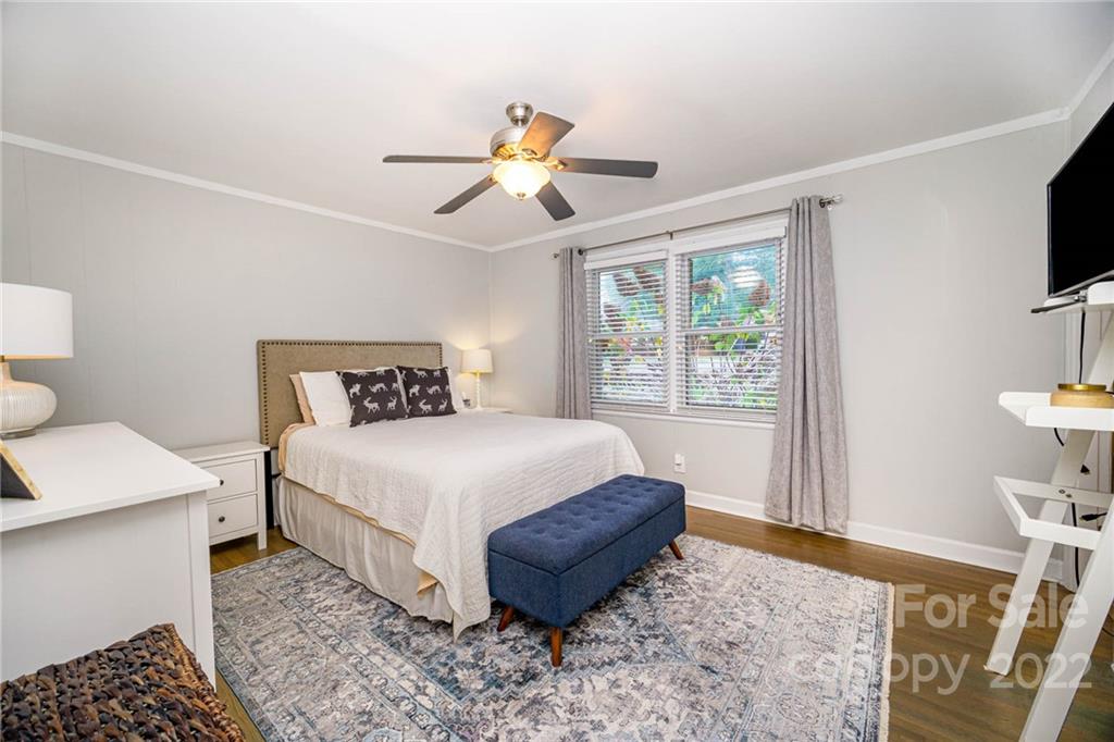 5200 Londonderry Road Charlotte, NC 28210 - Photo 8 of 28 a bedroom with a bed and a flat tv screen on dresser