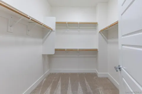 a view of an empty walk in closet