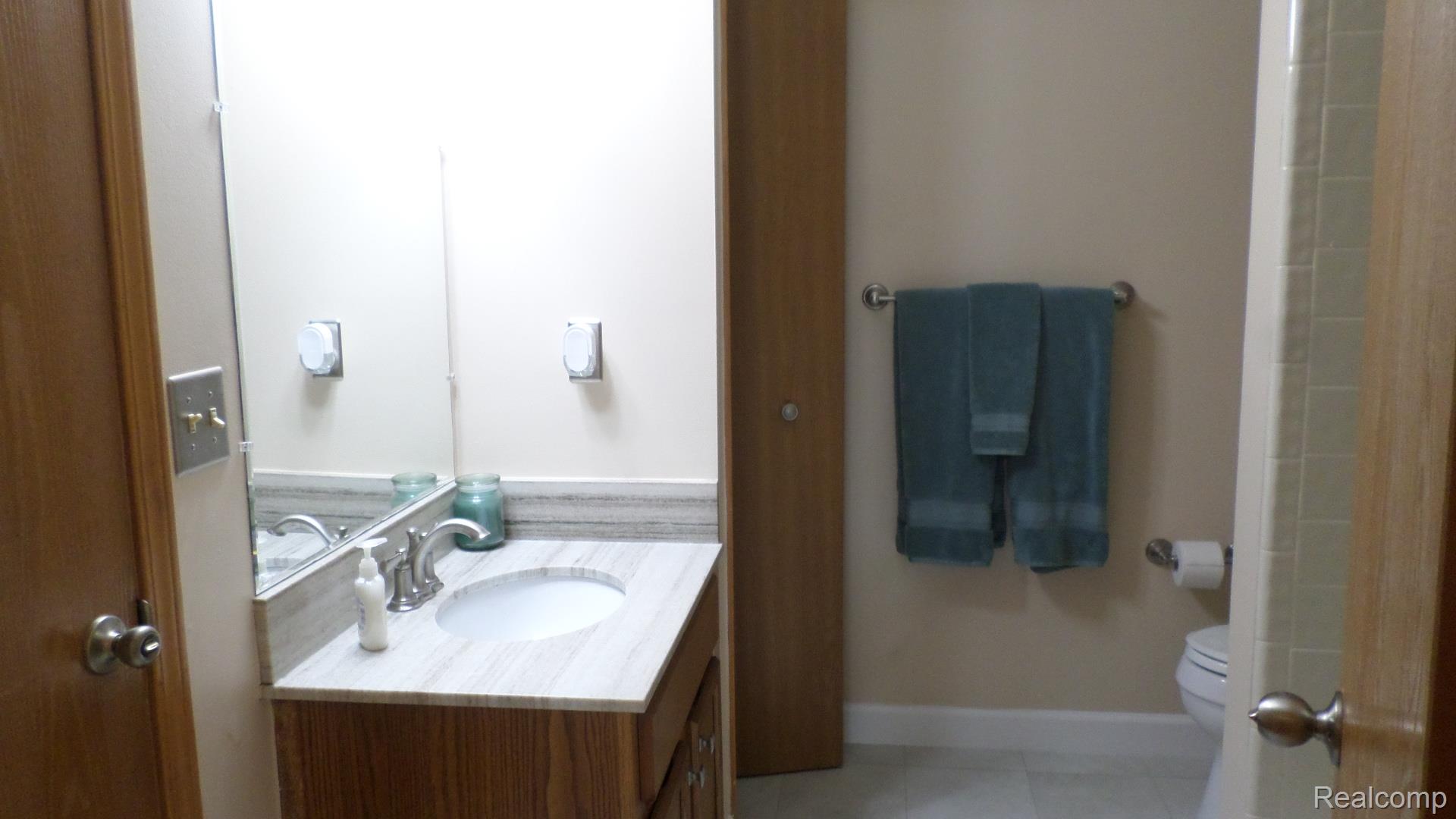 33831 Hooker Road, Unit 6 New Baltimore, MI 48047 - Photo 14 of 34 Full bathroom with vanity, light tile patterned floors, and a shower