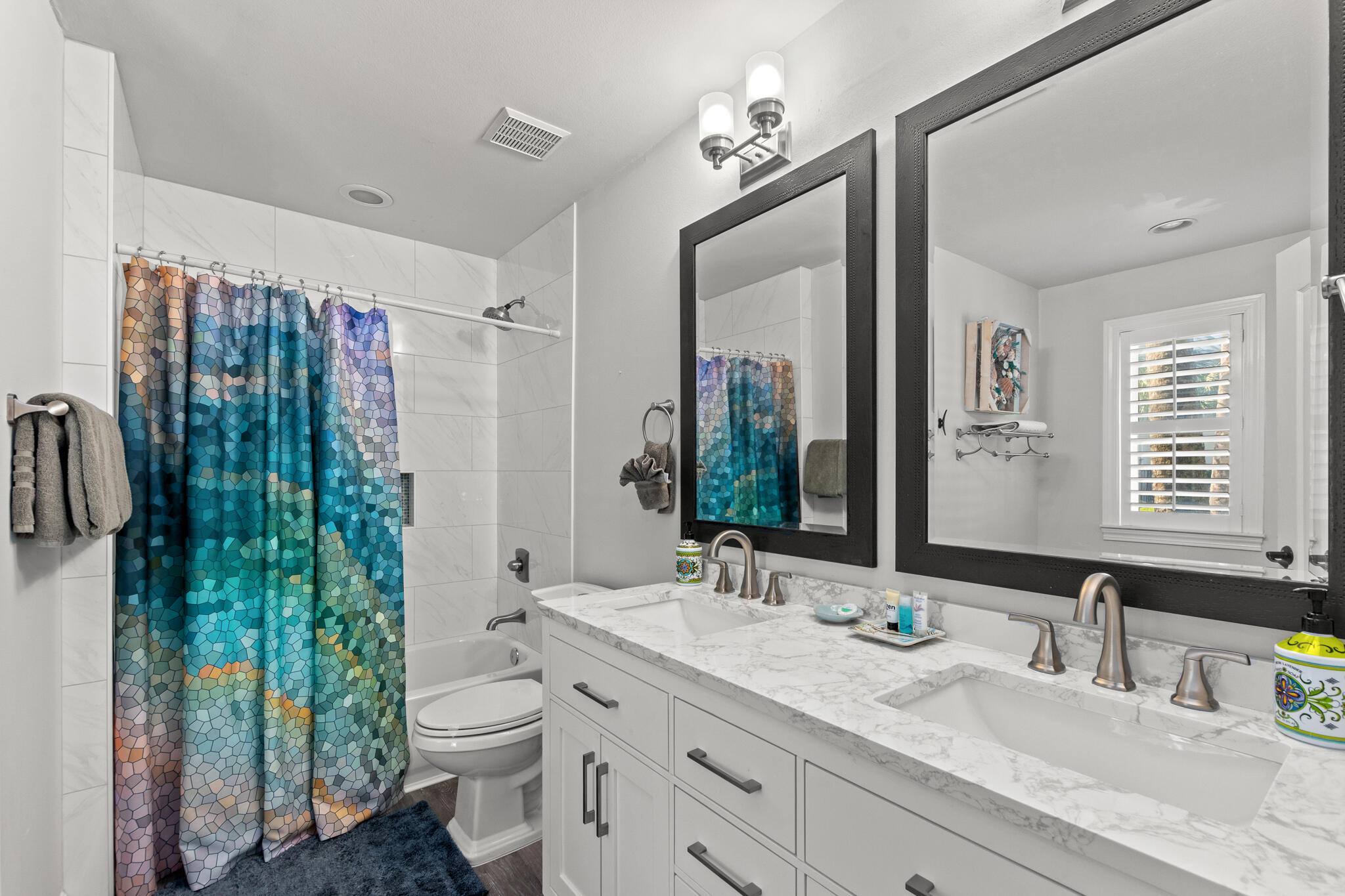 100 Sandprint Circle Destin, FL 32541 - Photo 24 of 62 a bathroom with a double vanity sink mirror and toilet