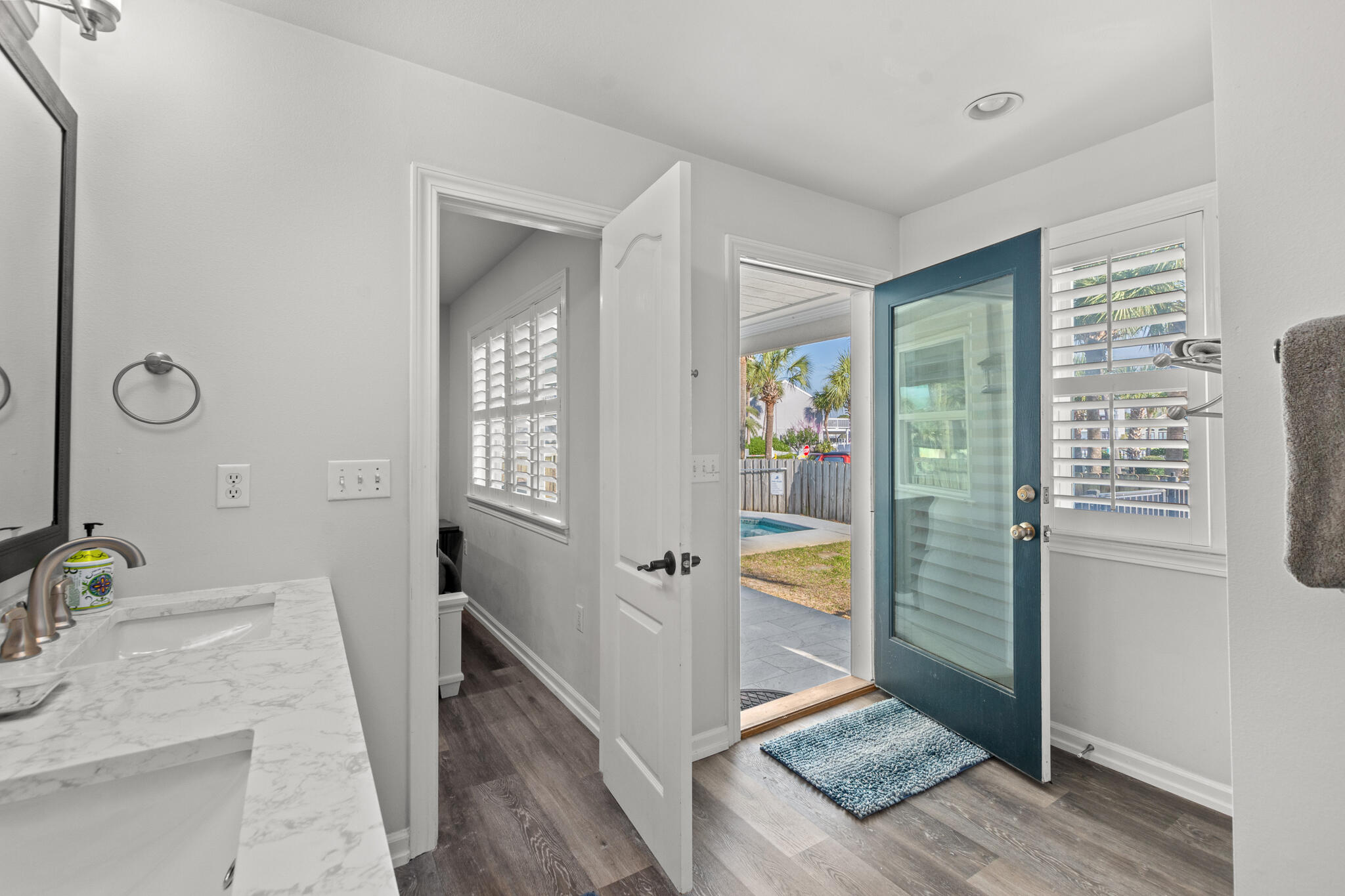 100 Sandprint Circle Destin, FL 32541 - Photo 25 of 62 a bathroom with a granite countertop sink a mirror and shower