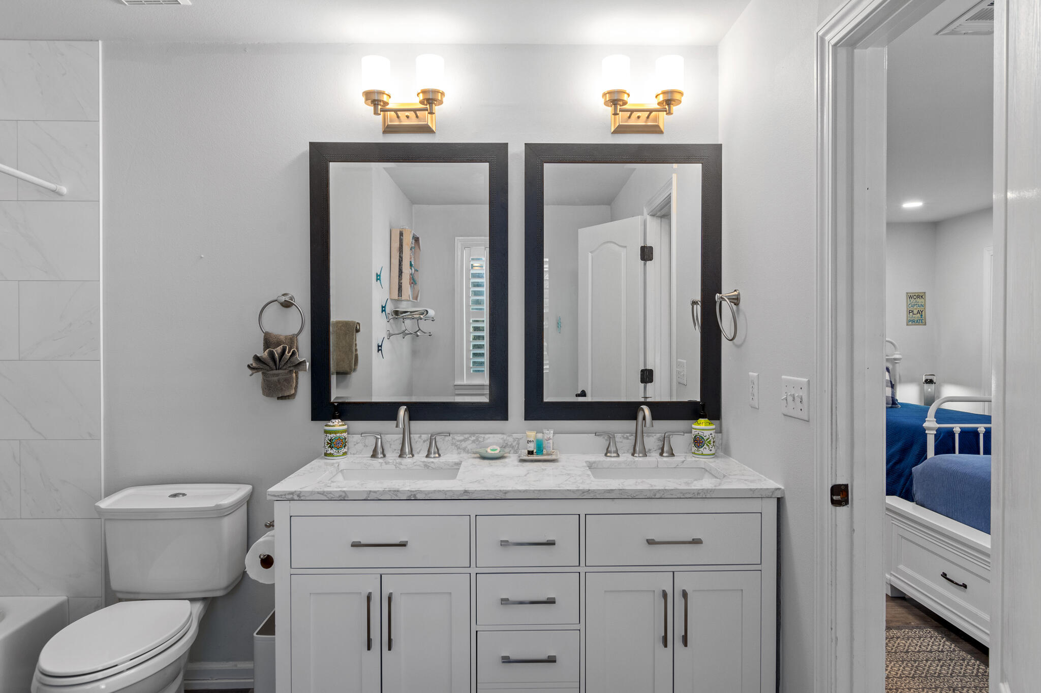 100 Sandprint Circle Destin, FL 32541 - Photo 26 of 62 a bathroom with a granite countertop toilet sink and mirror