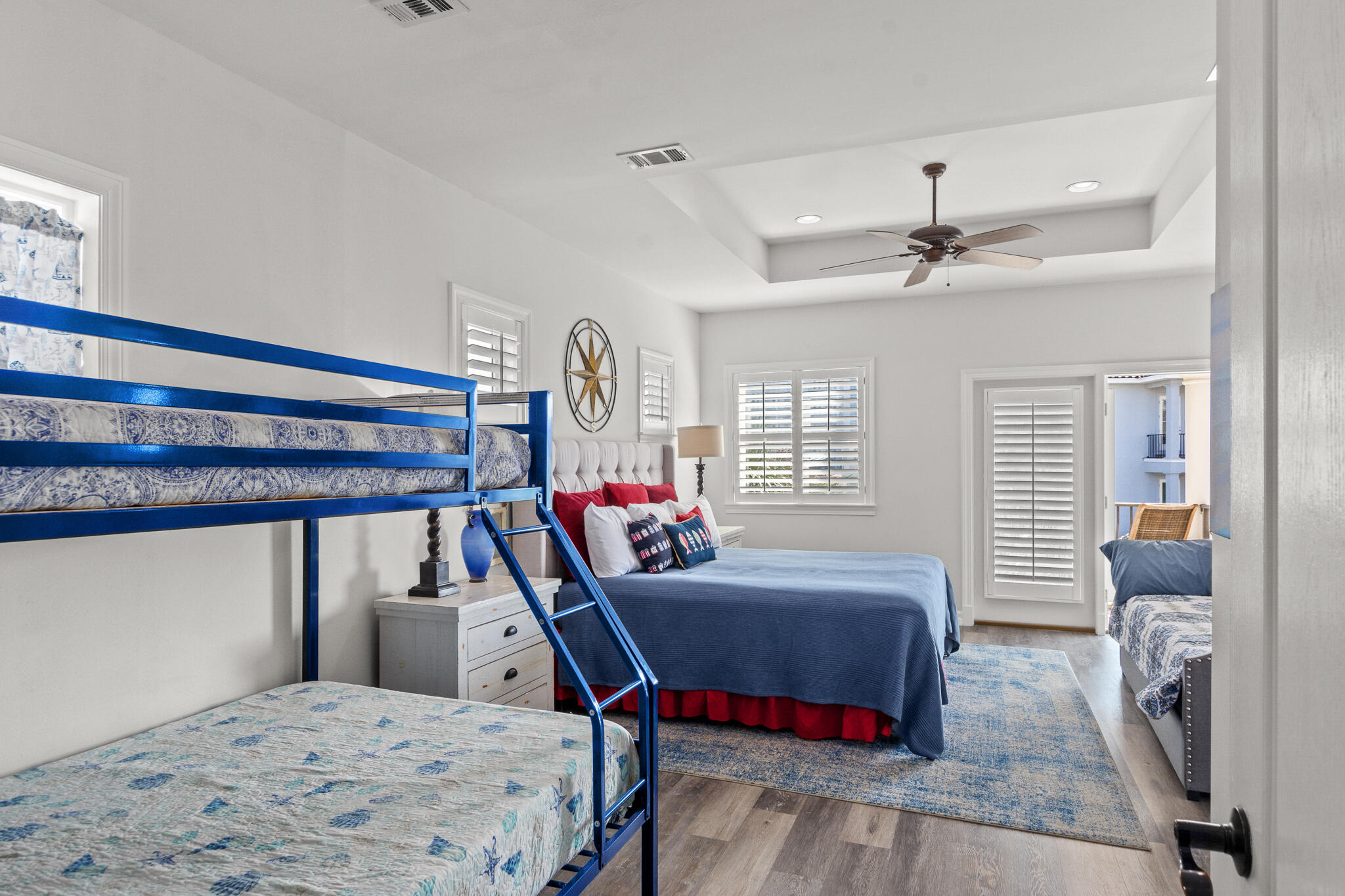 100 Sandprint Circle Destin, FL 32541 - Photo 35 of 62 a bedroom with a bed a chandelier and dresser