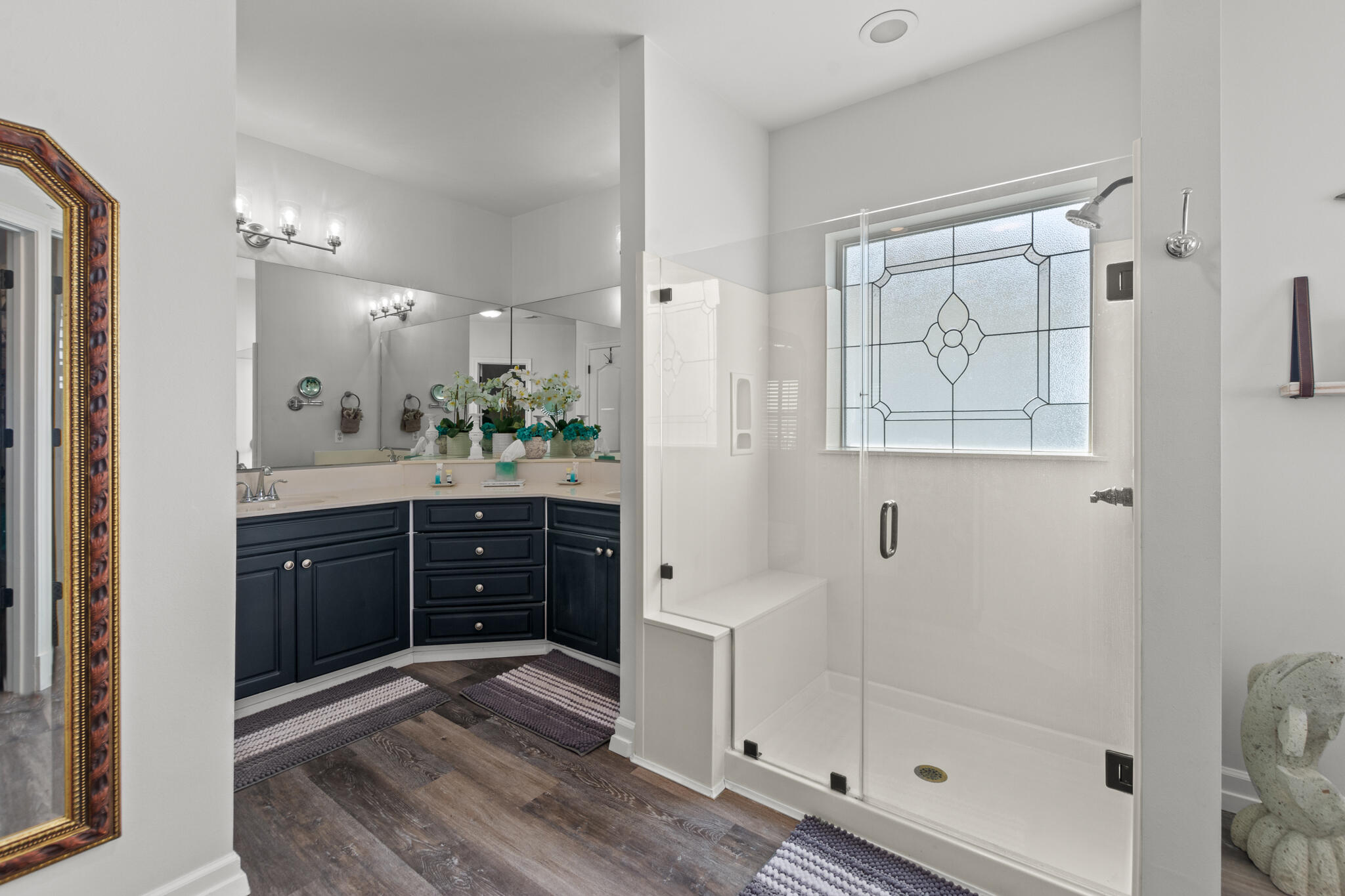 100 Sandprint Circle Destin, FL 32541 - Photo 47 of 62 a spacious bathroom with a shower sink and mirror