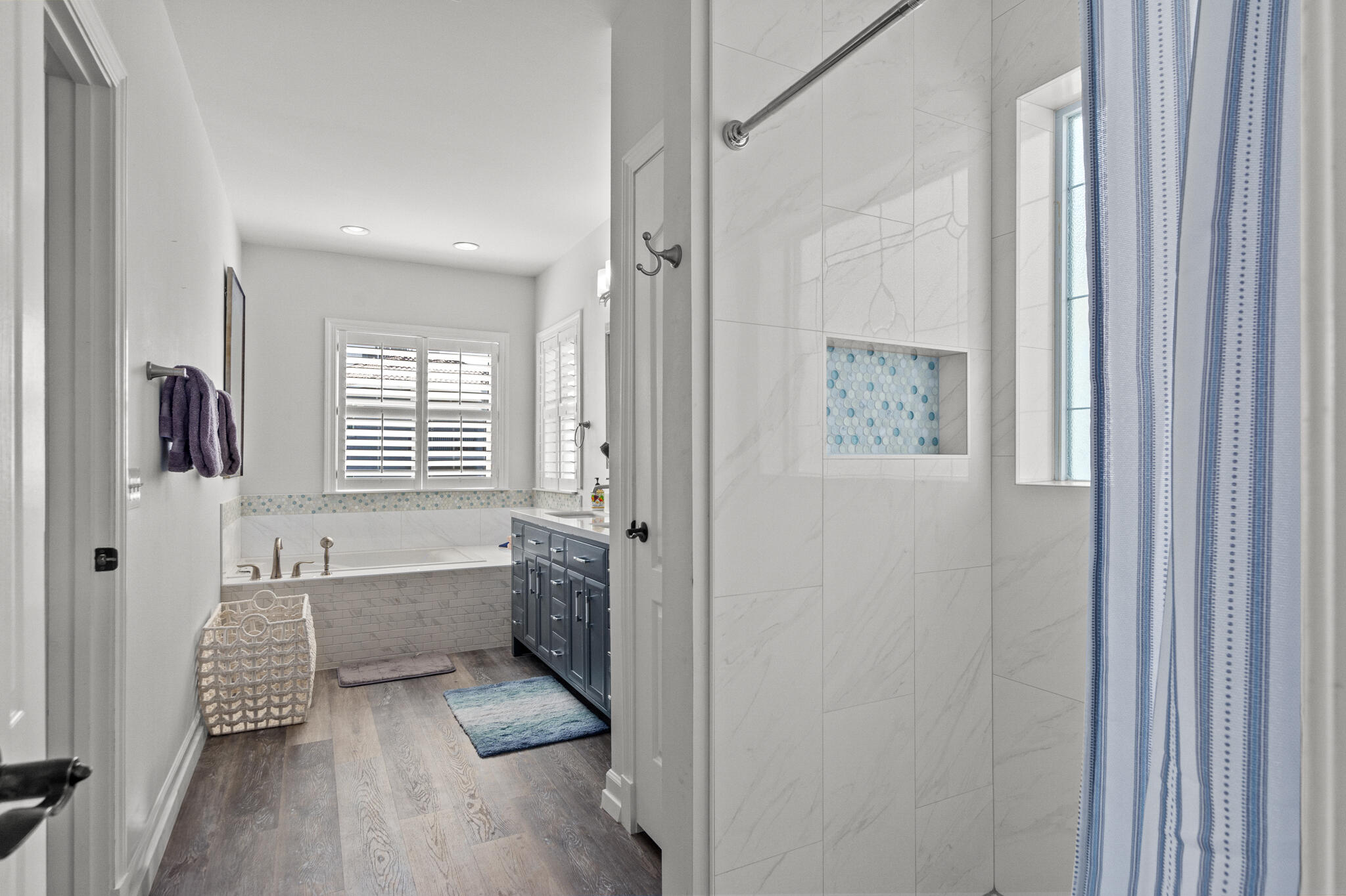 100 Sandprint Circle Destin, FL 32541 - Photo 50 of 62 a bathroom with bathtub wooden floor and a window