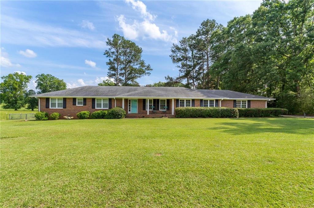 418 Bendview Road Griffin, GA 30223 - Photo 1 of 1 a front view of a house with a garden