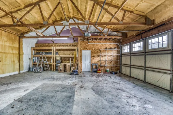 a view of a room with wooden walls