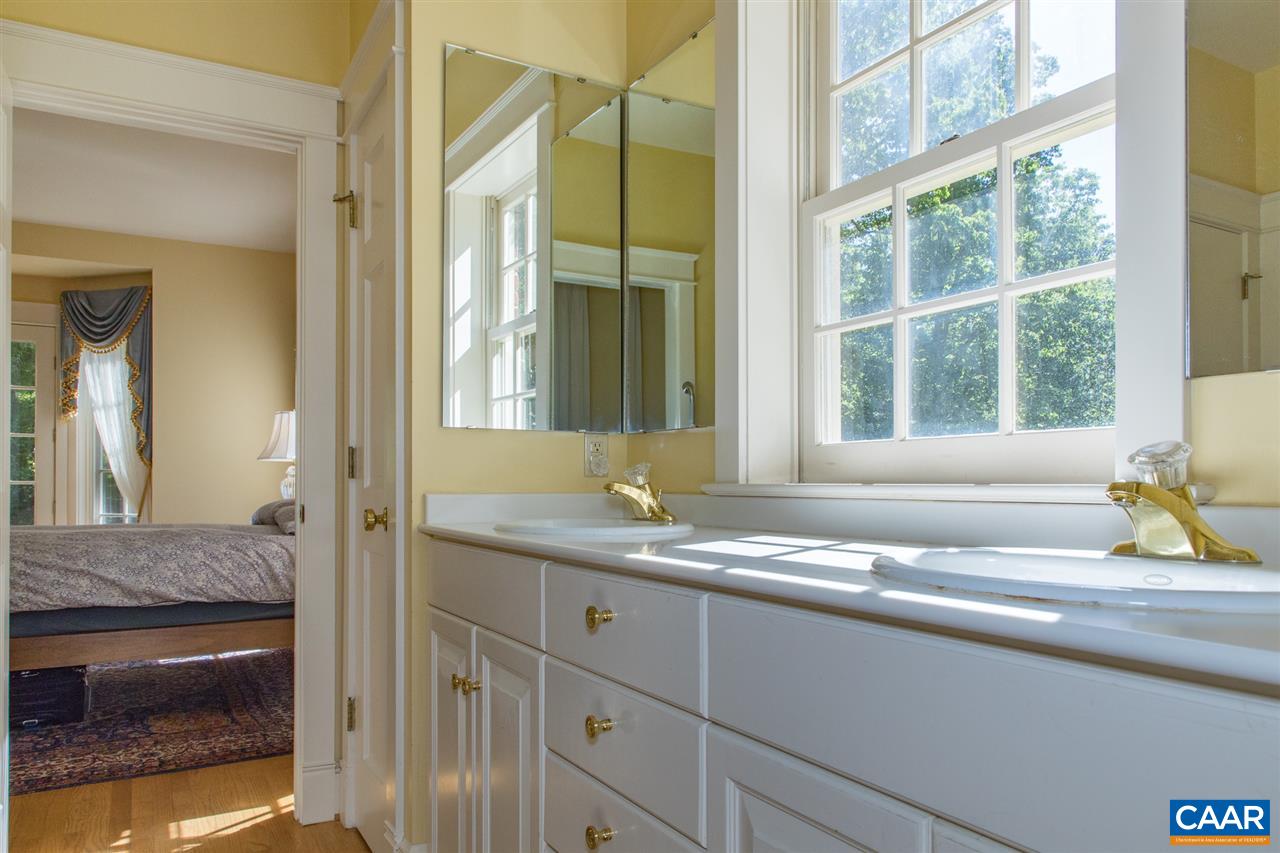 3897 Free Union Road Charlottesville, VA 22901 - Photo 19 of 47 a bathroom with a granite countertop sink and a mirror