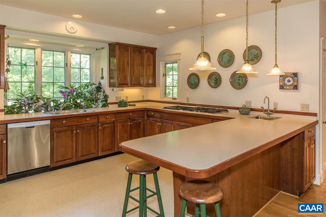 3897 Free Union Road Charlottesville, VA 22901 - Photo 23 of 47 a kitchen that has a sink and a stove