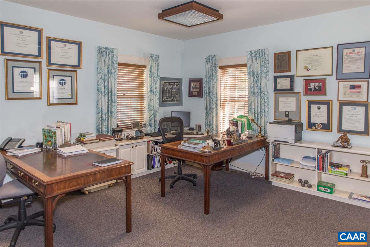 3897 Free Union Road Charlottesville, VA 22901 - Photo 28 of 47 a view of a workspace with furniture and a potted plant