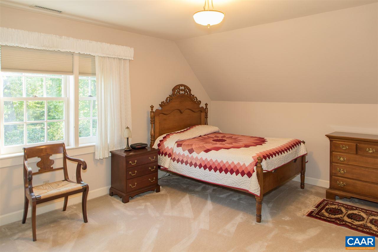 3897 Free Union Road Charlottesville, VA 22901 - Photo 32 of 47 a bedroom with a bed and a chair
