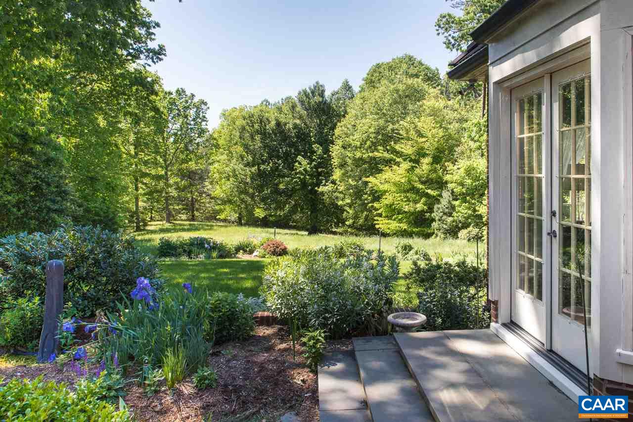 3897 Free Union Road Charlottesville, VA 22901 - Photo 5 of 47 a view of a garden with potted plants and large trees