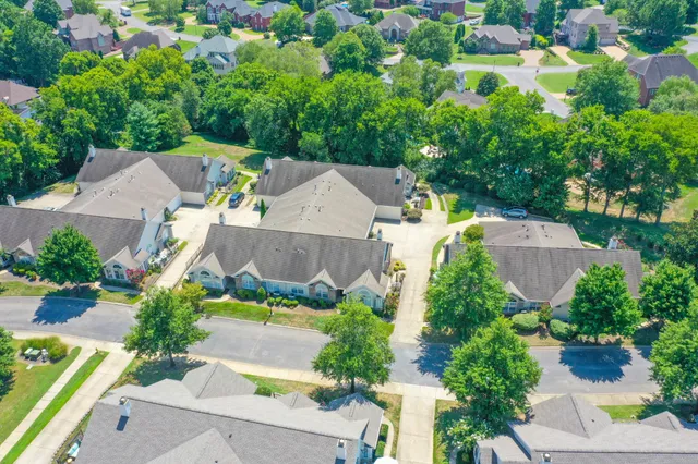 an aerial view of a house with a garden