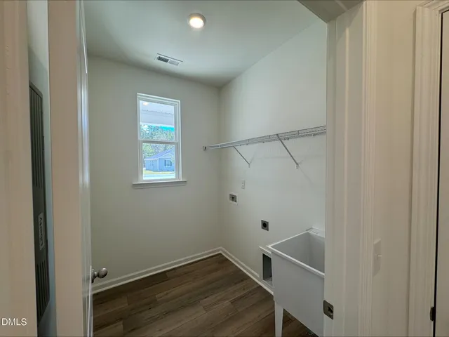 a view of a house with swimming pool in front of it