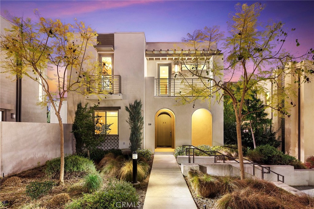 a front view of a building with outdoor seating