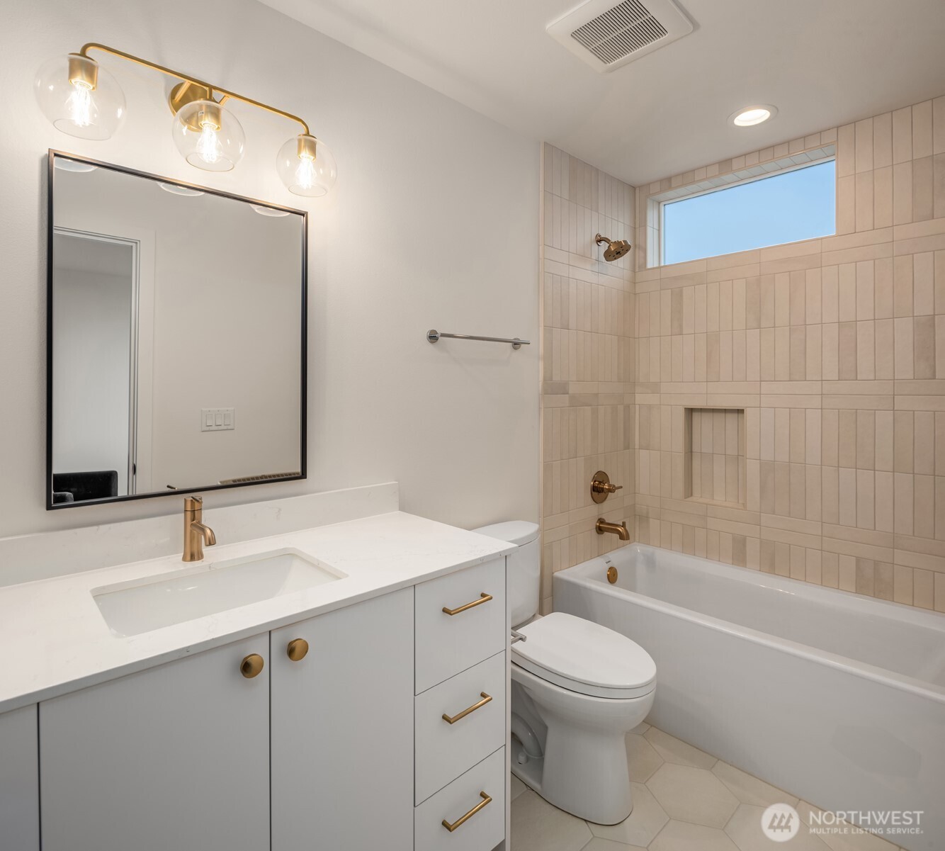 3612 Francis Avenue North Seattle, WA 98103 - Photo 15 of 36 a bathroom with a toilet a sink a mirror and bathtub