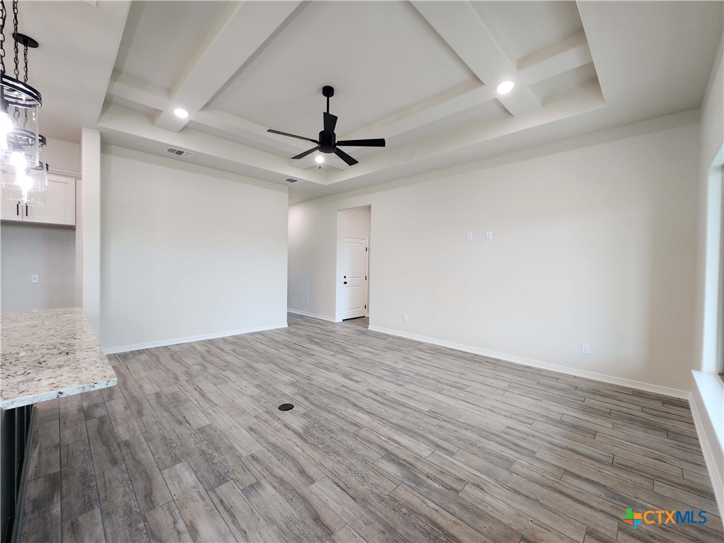 406 Talon Loop Salado, TX 76571 - Photo 6 of 31 a view of an empty room with wooden floor