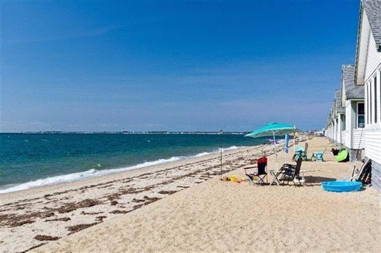 276 Shore Road, Unit 1 Truro, MA 02666 - Photo 3 of 12 a view of a lake with a beach