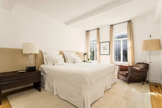 a kitchen with stainless steel appliances kitchen island a refrigerator sink and stove