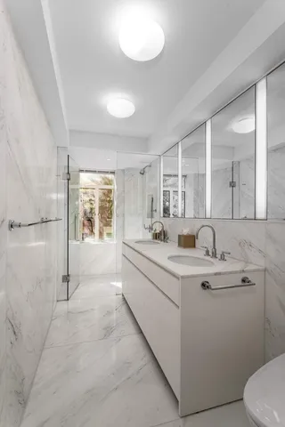 a bedroom with bed and window