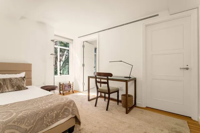 a bathroom with a double vanity sink toilet and a mirror