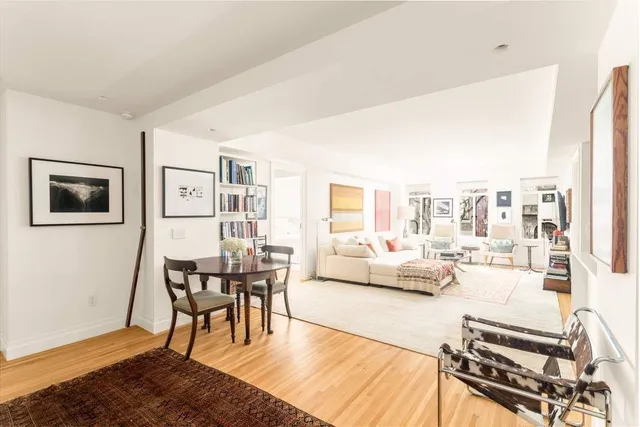 a living room with stainless steel appliances kitchen island granite countertop furniture and a kitchen view