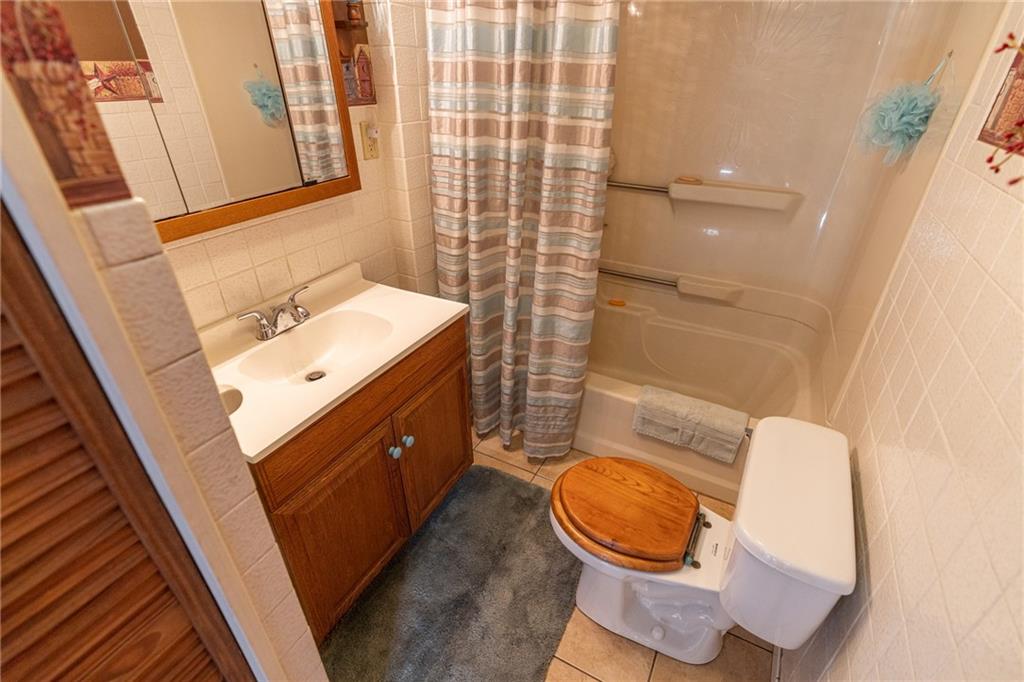 264 Baird Road Edinburg, PA 16116 - Photo 12 of 23 a bathroom with a sink a toilet and shower