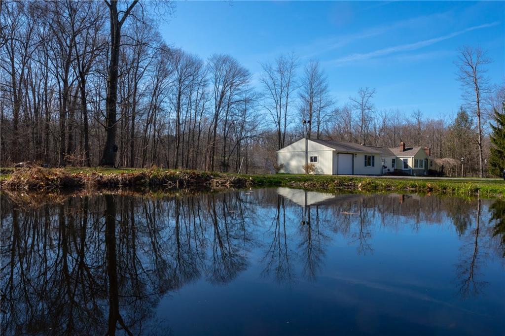 264 Baird Road Edinburg, PA 16116 - Photo 17 of 23 a view of swimming pool and trees in the background