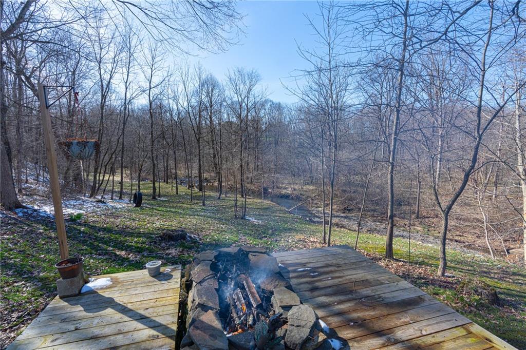 264 Baird Road Edinburg, PA 16116 - Photo 19 of 23 a view of a backyard with wooden fence