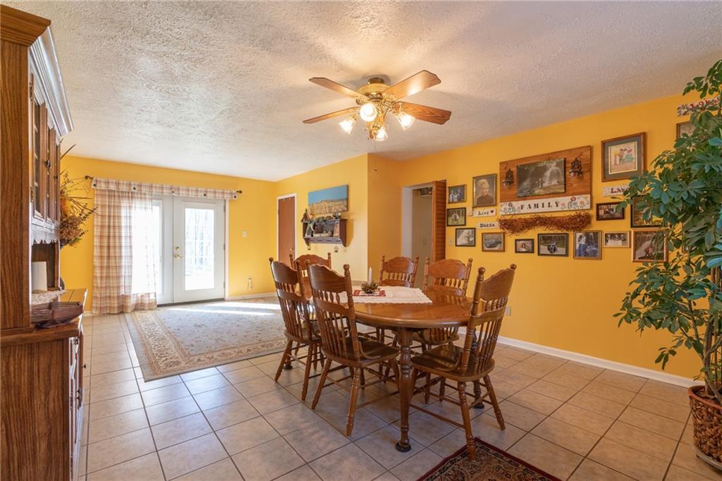 264 Baird Road Edinburg, PA 16116 - Photo 8 of 23 a dining room with furniture and window