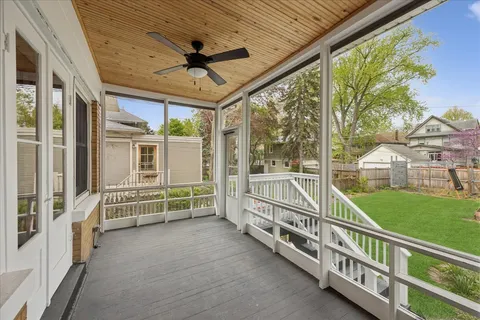 a view of a porch with furniture and garden