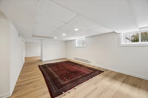 a view of a room with wooden floor and staircase