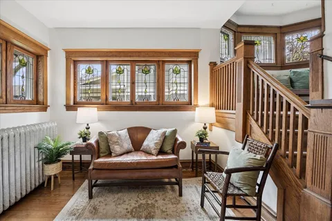 a outdoor living room with furniture and a window