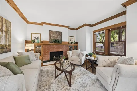 a living room with furniture and a fireplace