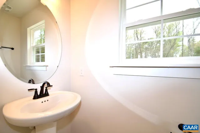 a bathroom with a sink and a window