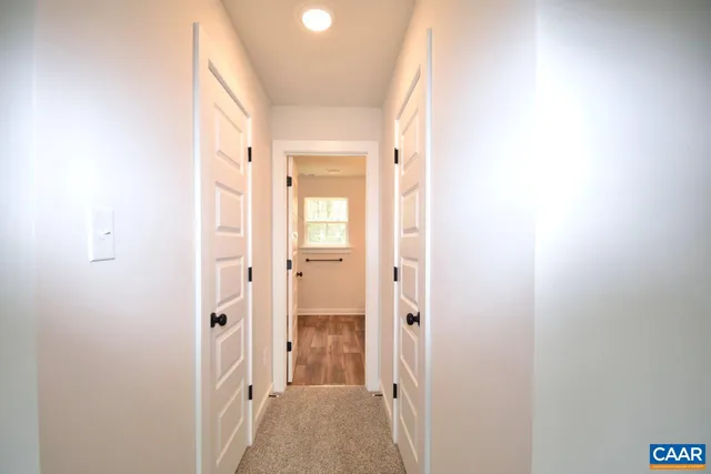 a view of a bathroom from a hallway