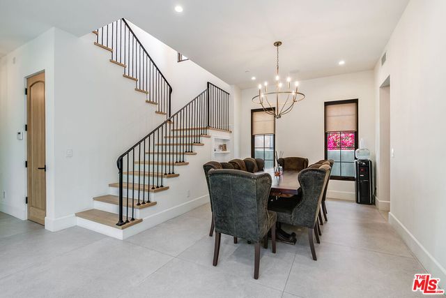 a view of a dining room with furniture and window