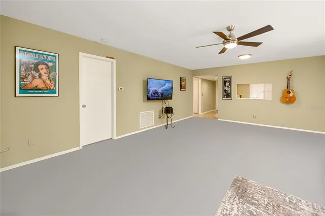 a view of livingroom with furniture and workspace