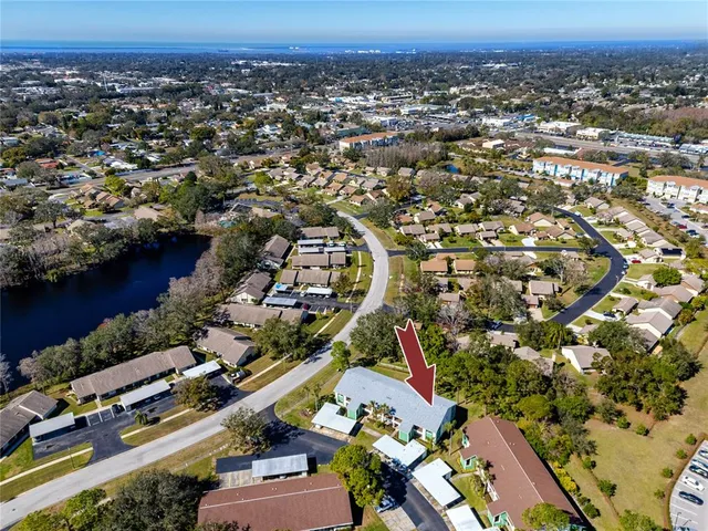 an aerial view of a houses and lake view