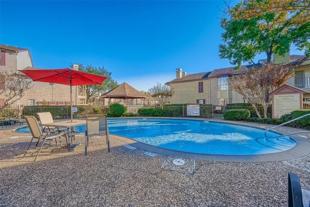 a view of a swimming pool with lounge chair