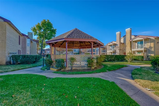 a view of a tall door next to a yard