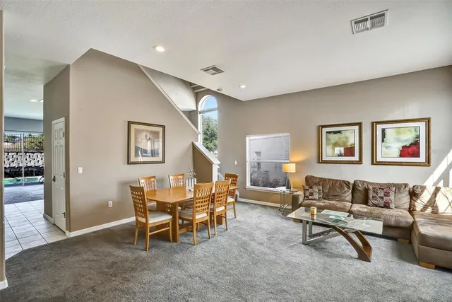 a living room with furniture and a rug